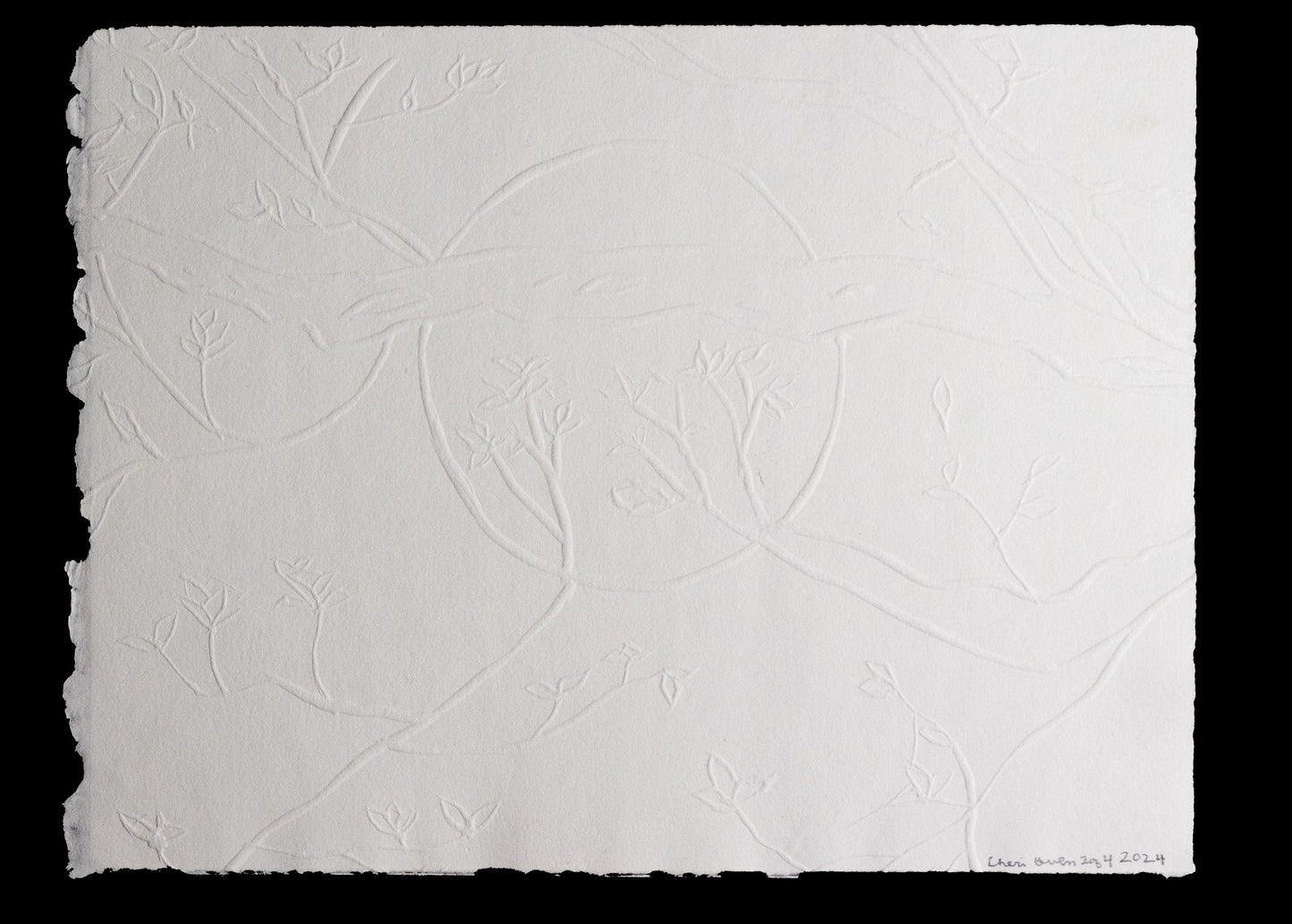 Embossed paper with delicate branches and leaf pattern signed by artist.