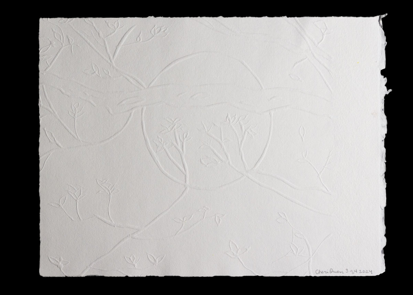 Embossed paper with delicate branches and leaf pattern signed by artist.