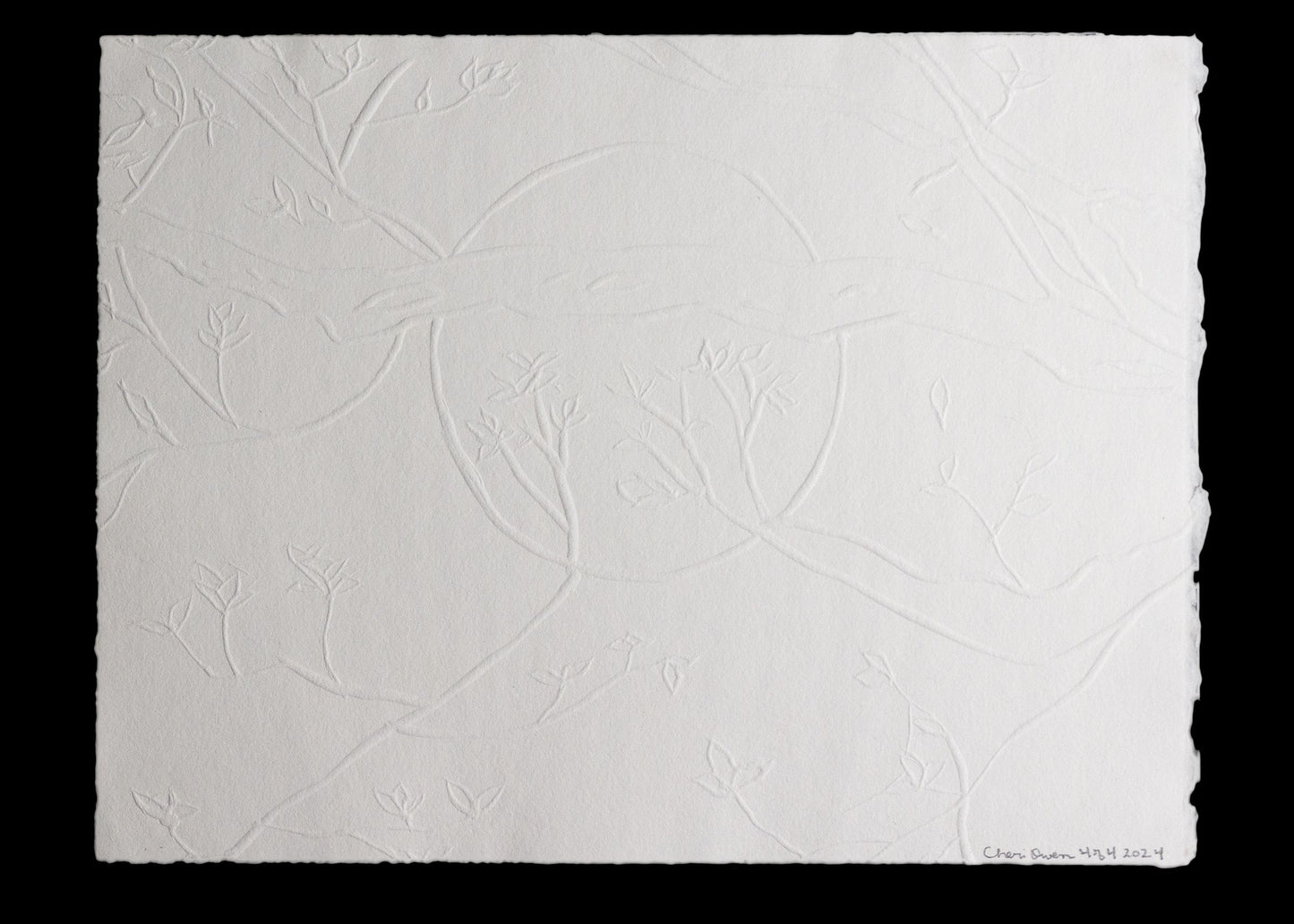 Embossed paper with delicate branches and leaf pattern signed by artist.