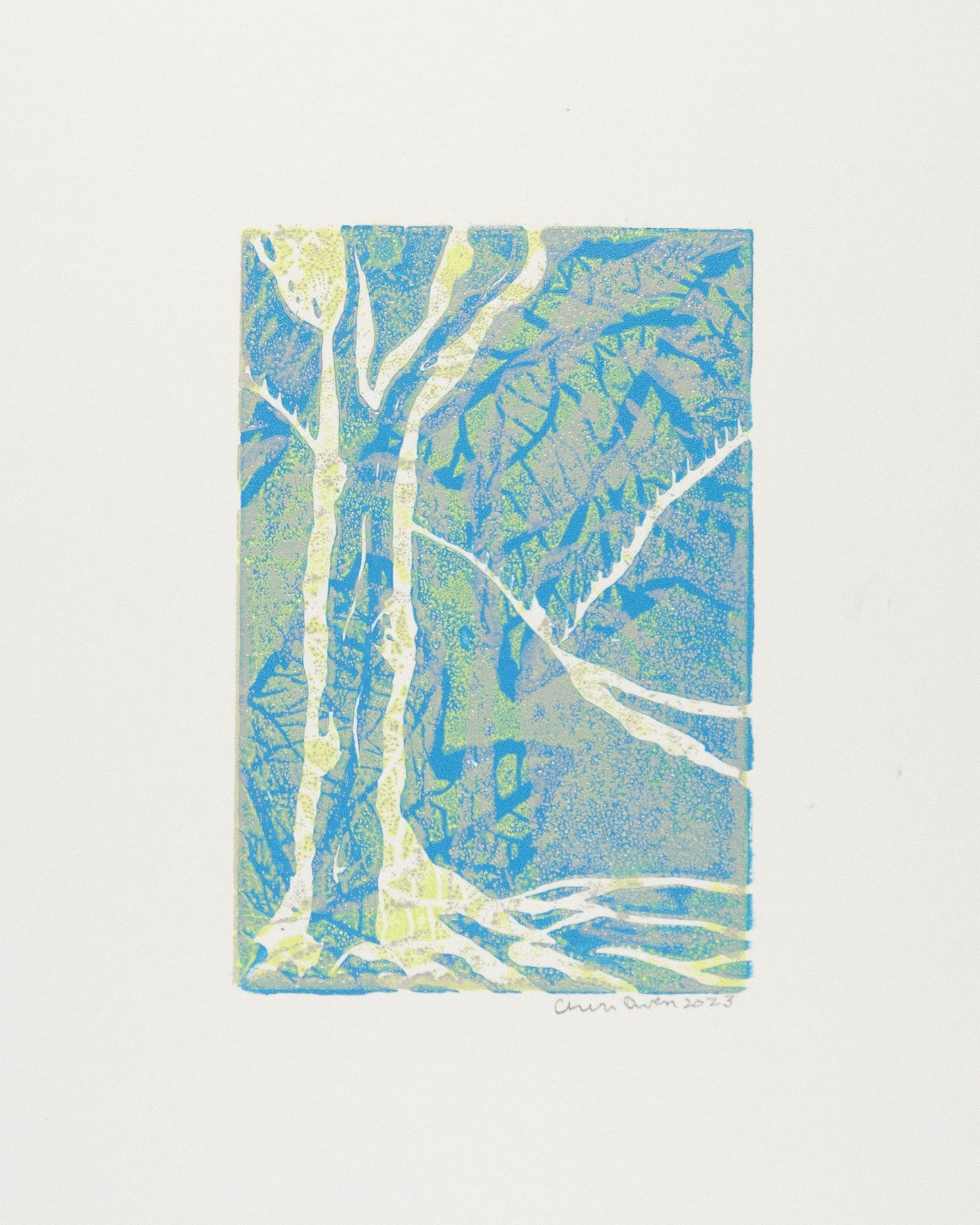 Abstract tree artwork with blue, green and yellow hues signed by artist.