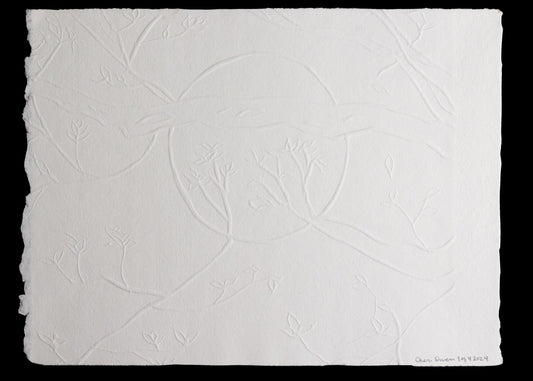 Embossed paper with delicate branches and leaf pattern signed by artist. 