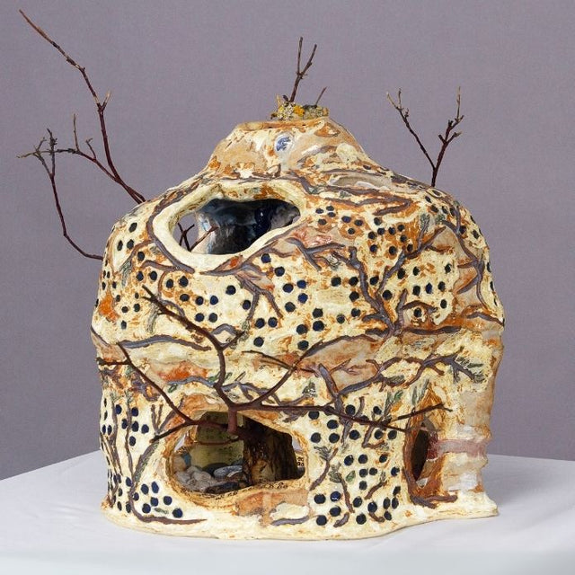 Ceramic Vase with holes, dots and branches with earthy tones. 