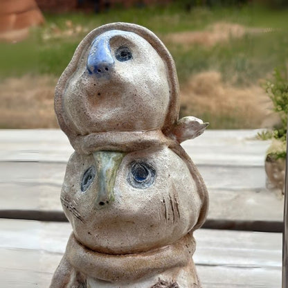 Side view of salt-fired ceramic with layered stains and carved surface from the “Beautiful Monsters”