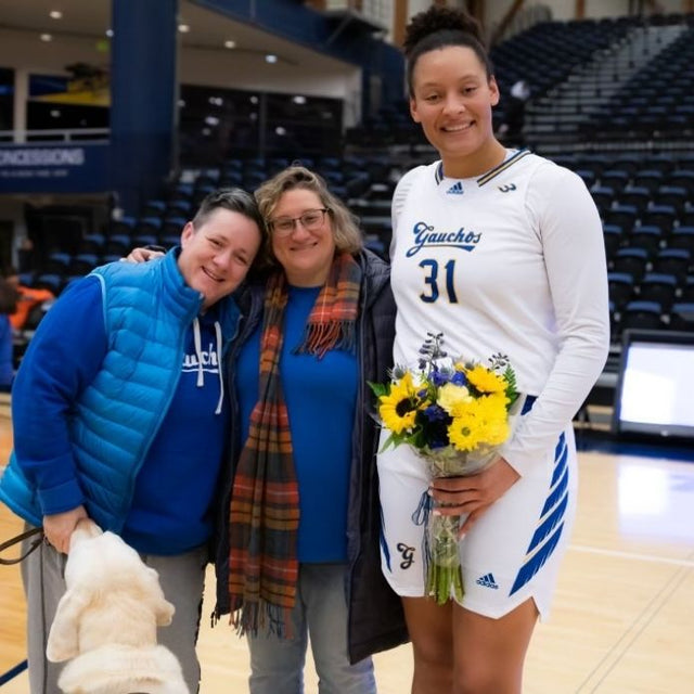 Cheri and Jenni with a Basketball Player. 