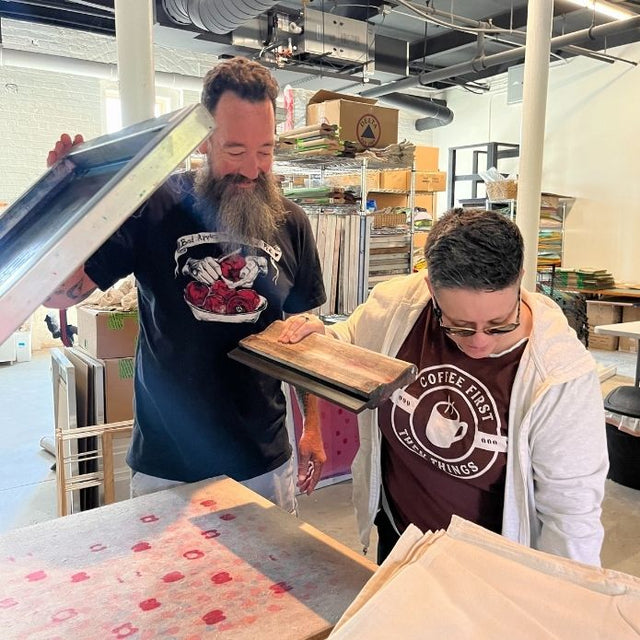 Cheri works with a friend artist in her printmaking studio.