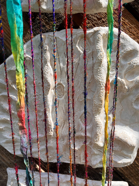 Forgive yourself Sculptures and Re-purposed colorful sari thread. 