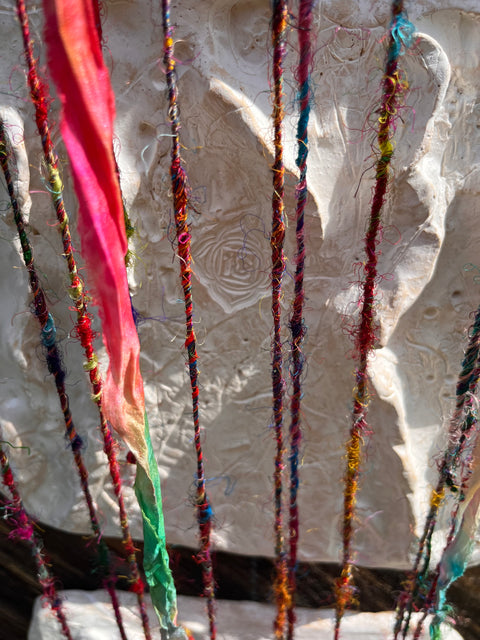 Forgive yourself Sculptures and Re-purposed colorful sari thread. 