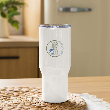 White tumbler with a logo on a woven mat in a kitchen setting