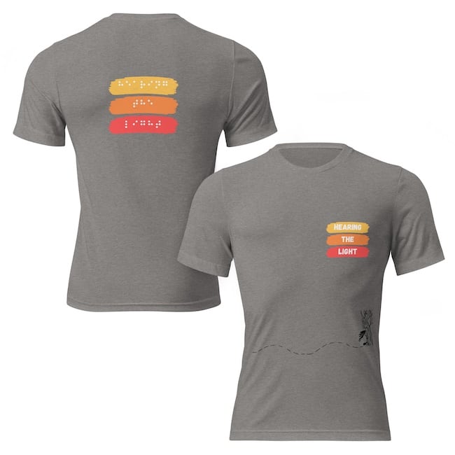 Unisex tri blend t-shirt grey front and back says hearing the light in yellow, orange and red. 