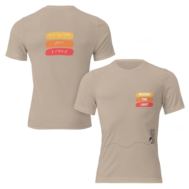 Unisex tri blend t-shirt tan front and back says hearing the light in yellow, orange and red. 