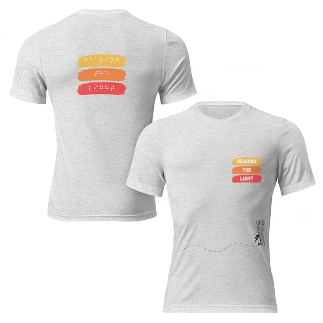 Unisex tri blend t-shirt tan front and back says hearing the light in yellow, orange and red. 