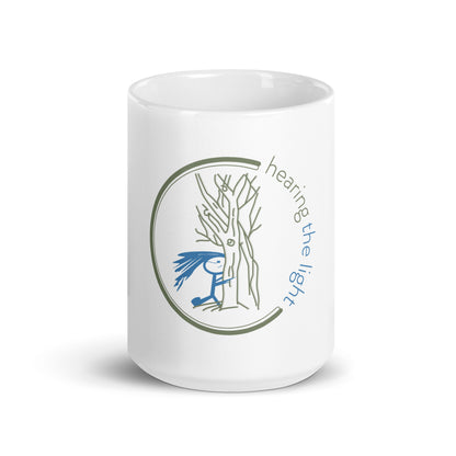 White mug with text 'hearing the light' on a white background
