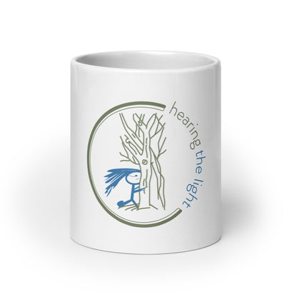 White mug with a design, accompanied by text, on a white background.